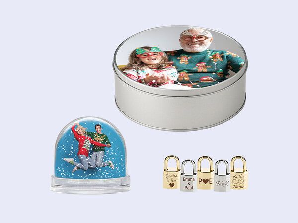 BIPA Fotoshop Gravur- und Fotogeschenke wie Schneekugel, Blechdose und Liebesschloss mit individuellen Motiven.